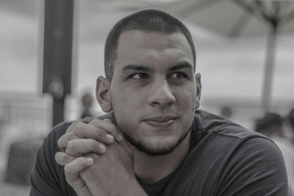 a man with a black shirt and a black and white photo